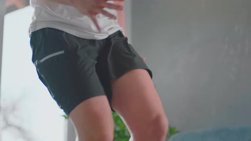 Adult Performing Step Up Exercise At Home