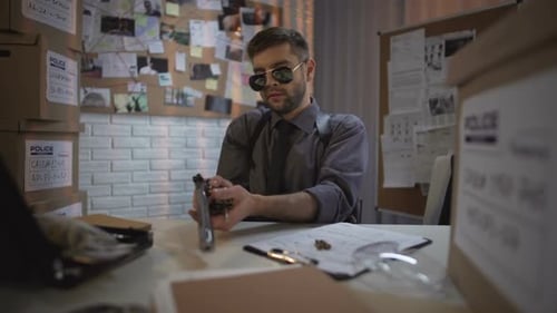 Policeman in Office Charging the Gun on Table, Law and Order, Criminals Raid