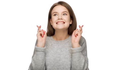 Young Woman Fingers Crossed Hoping For Luck
