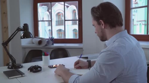 Rear Back View on the Male That Write Letter