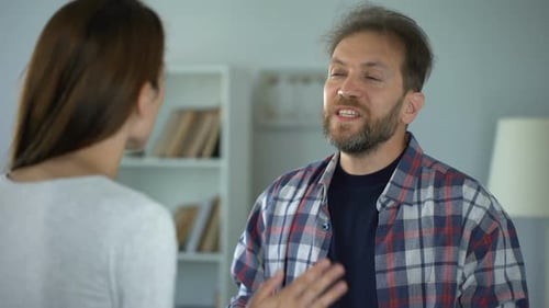 Couple Arguing in a Brightly Lit Home