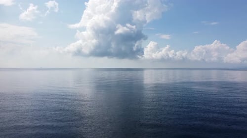 Move at the sea in blue sunny white cloud day