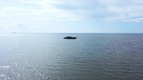 Aerial View Of Yacht Or Boat With People Cruising At Open Sea