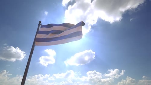 Dynamic Flag Waving in Sunlight Against Cloudy Blue Sky