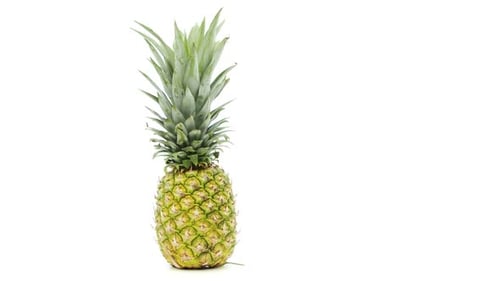 Fresh Pineapple with Green Crown on White Background
