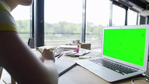 Side View of Young Woman Student Working on Laptop Green Screen Chromakey at Home Office