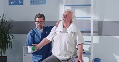 Senior Man Exercising with Physical Therapist