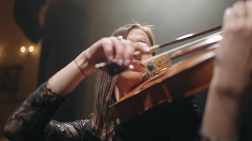 Young Talented Woman is Playing Violin in Philharmonic Hall Closeup Portrait of Female Musician