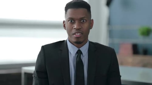 Man in Suit Yelling in Anger