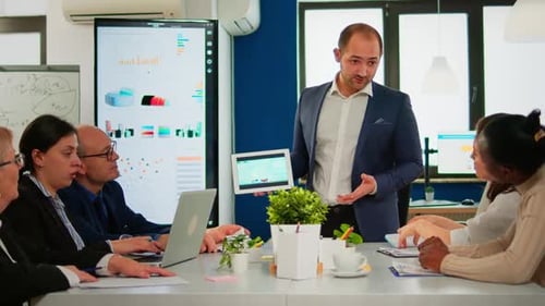 Business Team Meeting with Data Presentation