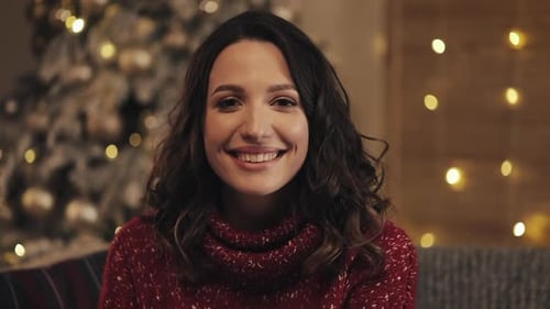 Smiling Woman in Festive Christmas Scene