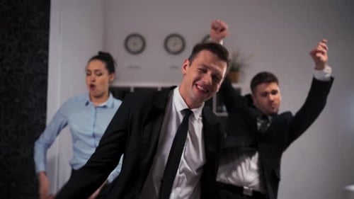 We Happy of Week End Start Employees Expressive Dancing Cheerfully in Office