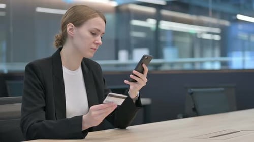 Woman Shopping Online with Credit Card on Phone