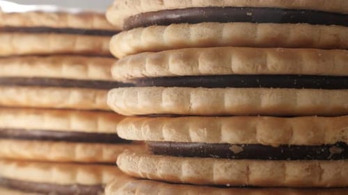 American chocolate sandwich cookies pile close-up slow tilt 4K 2160p 30fps UltraHD footage - Sandwi