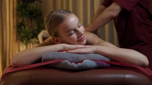 Woman Enjoying a Relaxing Massage at a Spa