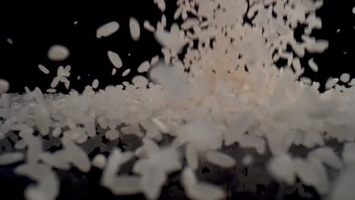 Rice Grains Cascading Down in a Close-Up Shot
