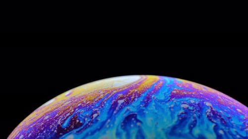 Iridescent Soap Bubble Surface Reflecting Colors and Light