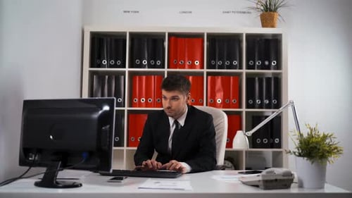 Businessman Working with Table Pc in Office