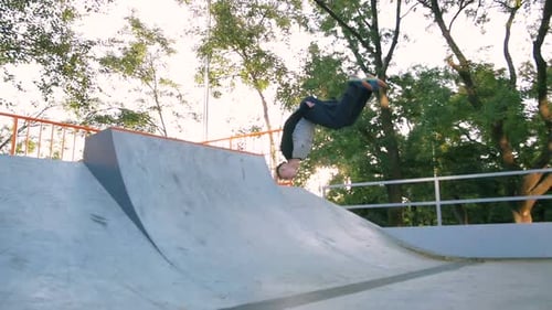 Young Man Doing Parkour Tricks in Extreme Sports Park