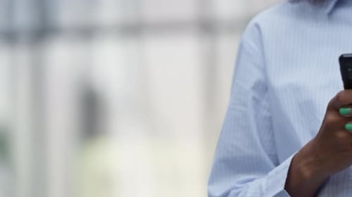 Woman Texting on Cellphone in Urban Setting