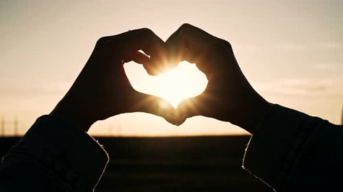 Woman Making Sign of Shape Heart