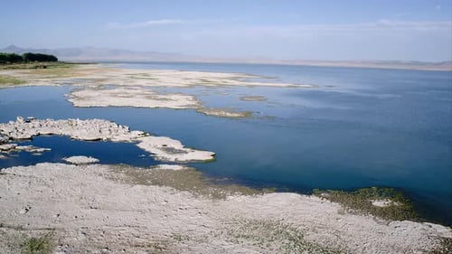 Views of rocky shoreline while flying