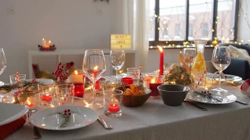 Festive Holiday Table Setting with Candles and Decorations