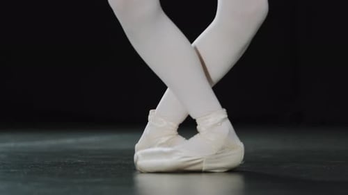 Ballerina Dancing En Pointe in the Dark