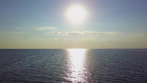 Flying Over the Sea Waves During Sunset