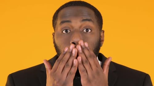 Surprised Black Man in Suit Making Wow Gesture, Exciting Business Market News