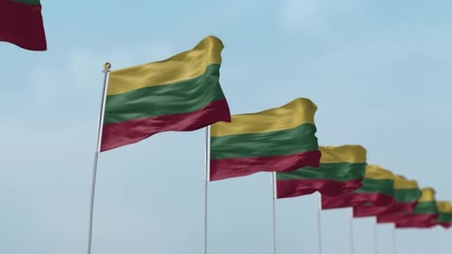 Waving Lithuanian Flags Line Up Against Blue Sky