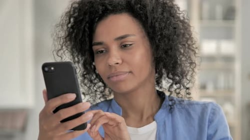 Portrait of African Woman Using Smartphone