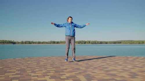 Slow Motion Woman Jumping on Pier