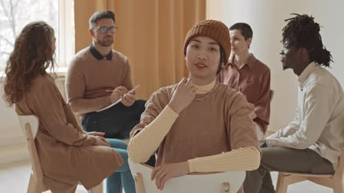 Group Therapy Session in Well Lit Room