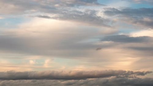 Dramatic Clouds Moving Across the Sky at Sunset