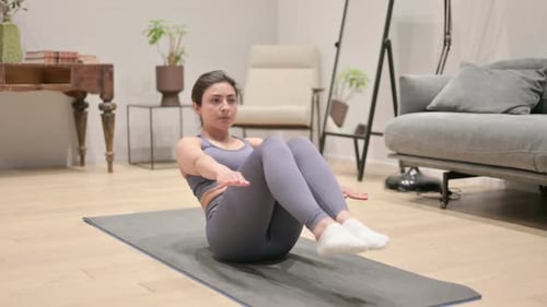 Woman Doing Abdominal Workout on Yoga Mat