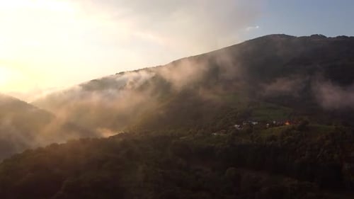 Hills And Clouds Aerial View In Apuseni Mountains In Romania