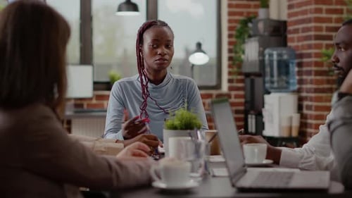 Close Up of Employee Talking to Colleagues About Business Project