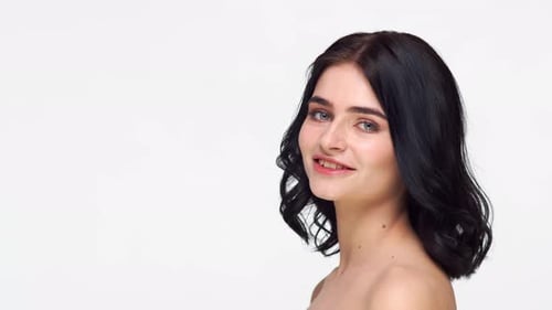Studio portrait of young and beautiful brunette woman.