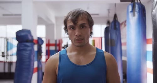 Front view of caucasian man at the boxing gym