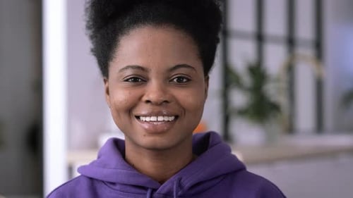 Smiling Woman in Purple Hoodie Close-Up