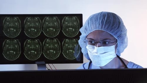 Doctor In Radiology Examining X-rays 14