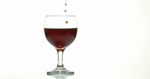 Red Wine Being Poured Into a Wine Glass