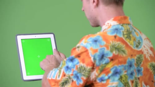 Adult Using Digital Tablet with Chroma Key Background