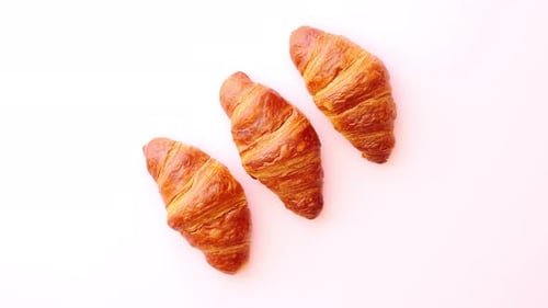 Row of Three Fresh and Delicious Croissants