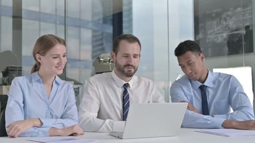 Executive Business People Doing Video Chat on Laptop on Office Table