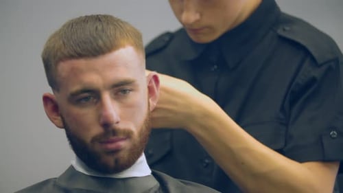 Young Adult Getting Haircut at Barbershop