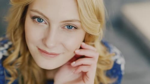 Woman Smiling Gently in a Portrait Close-Up