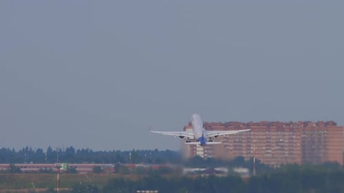 Passenger Airplane Takes Off From Airport Runway