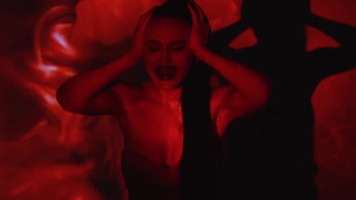 Distressed Woman Screaming in Red Light